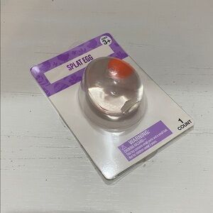 Splat Egg Toy - Clear Shell with Orange Center